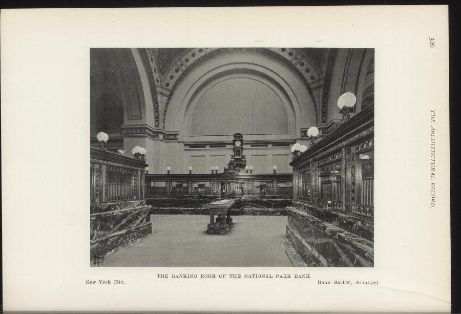 Black and white photograph of the interior banking room of the National Park Bank in New York City, featuring tables, lighting fixtures, and a wall clock, with text at the bottom.