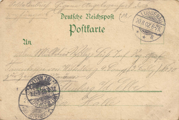 Eine alte braune Postkarte mit zwei Stempeln, einer mit der Aufschrift "Lubbenau, Deutschland, 2. Reichsspott Politarte" und handgeschriebener Text.