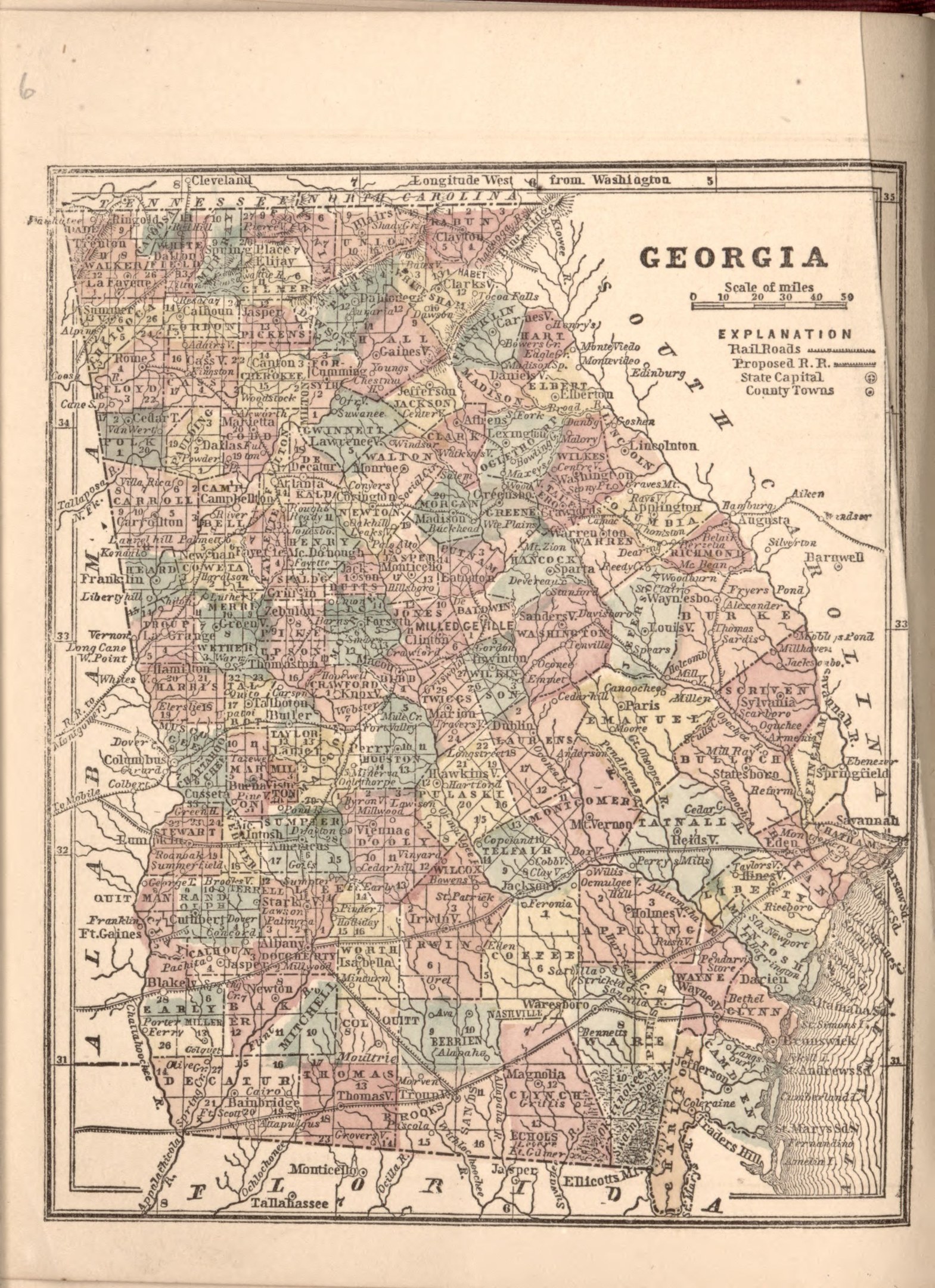 A worn book featuring a detailed map of Georgia, including counties and cities, with accompanying text.