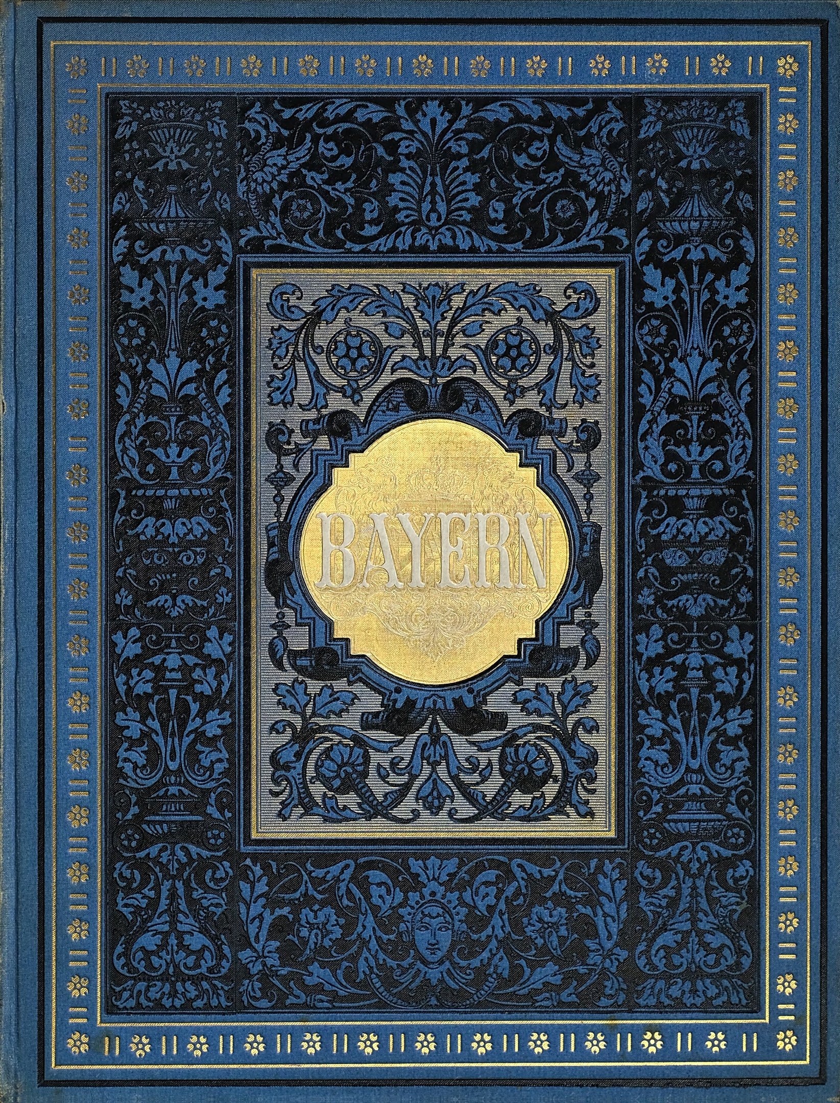 A blue and gold book with the word "Bayern" on its intricately designed cover.