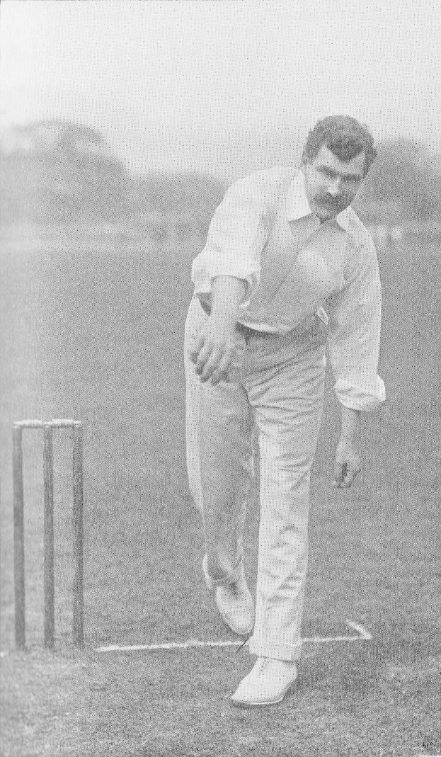 Ein Mann in weißer Cricket-Uniform spielt in einem Spiel mit Wickets auf dem Boden, umgeben von Bäumen und Himmel, mit dem Text "Cricket Player of the Year" unten.