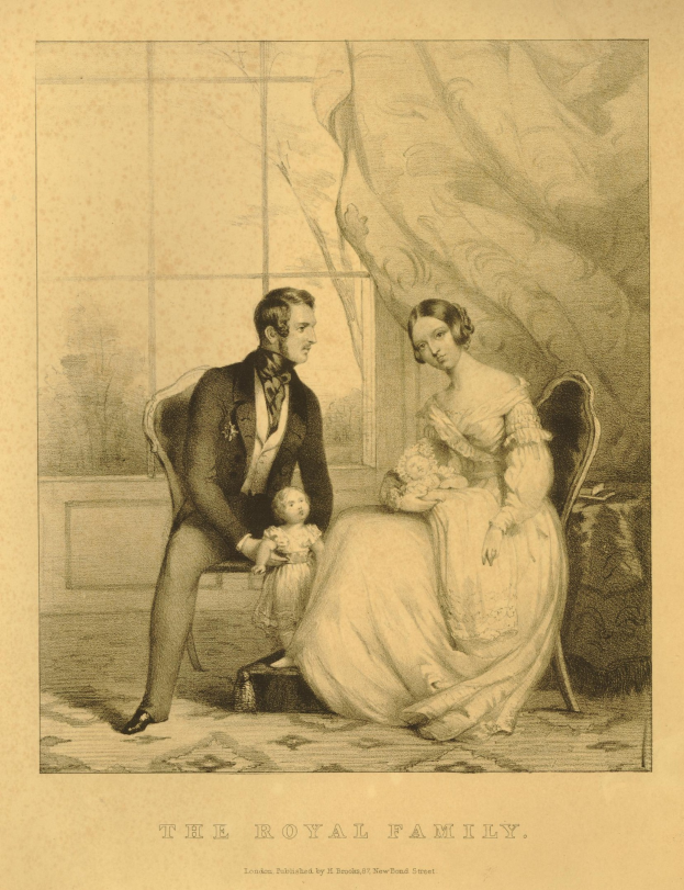 A man and woman sit on a chair with the woman holding a baby, behind them a window with a curtain, and text at the bottom reading "The Royal Family".