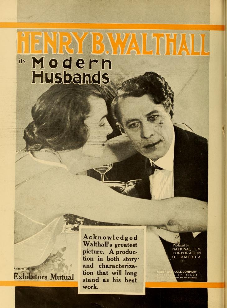 Buchumschlag mit einem Mann und einer Frau in inniger Umarmung und dem Text "Henry B. Walthall in Modern Husbands" darunter.