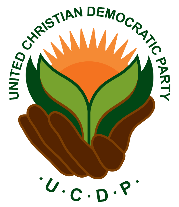 Eine Hand, die eine leuchtend gelbe Blume mit einem grünen Stiel und Blättern hält, die in einem blauen und gelben Kreis auf einem weißen Hintergrund dargestellt ist, mit dem darunter geschriebenen Text "UCDP" in fetter, schwarzer Schrift.