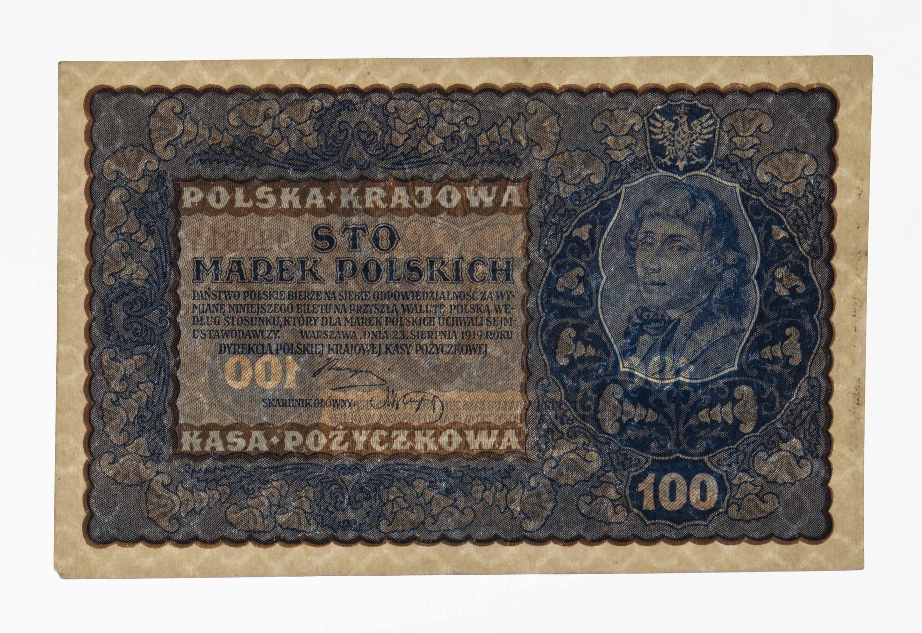 Alte polnische Banknote mit einem Mann im Anzug und Krawatte mit ernstem Gesichtsausdruck, Text "Polska krajowa" auf weißem Hintergrund.